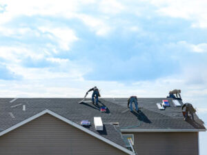licensed roofer team repairing roof