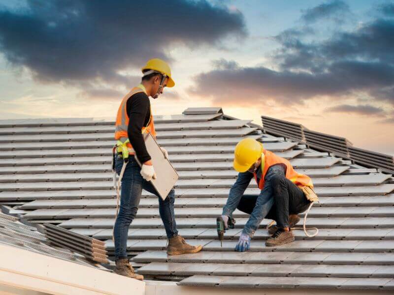 roofers install tiles per roofing job requirements