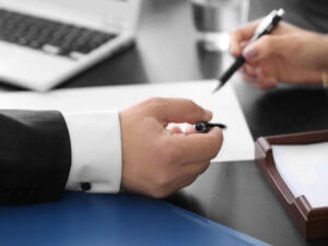 public adjuster reviewing and signing documents