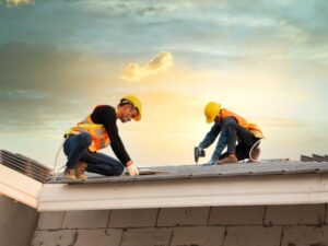 roofing professionals installing metal sheets