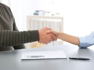 shaking hands with a licensed public adjuster